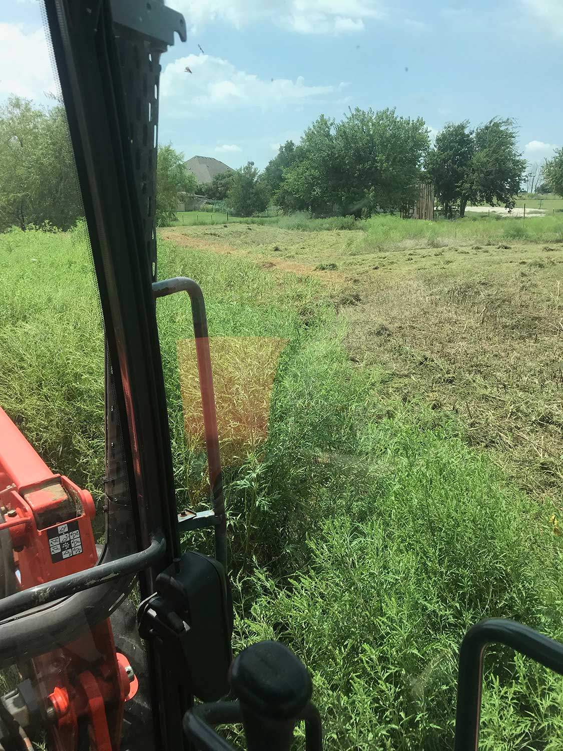 Cutting tall grass and lot clearing